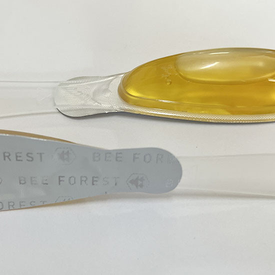 What should be noted when using aluminum foil sealing film to seal honey bottles?